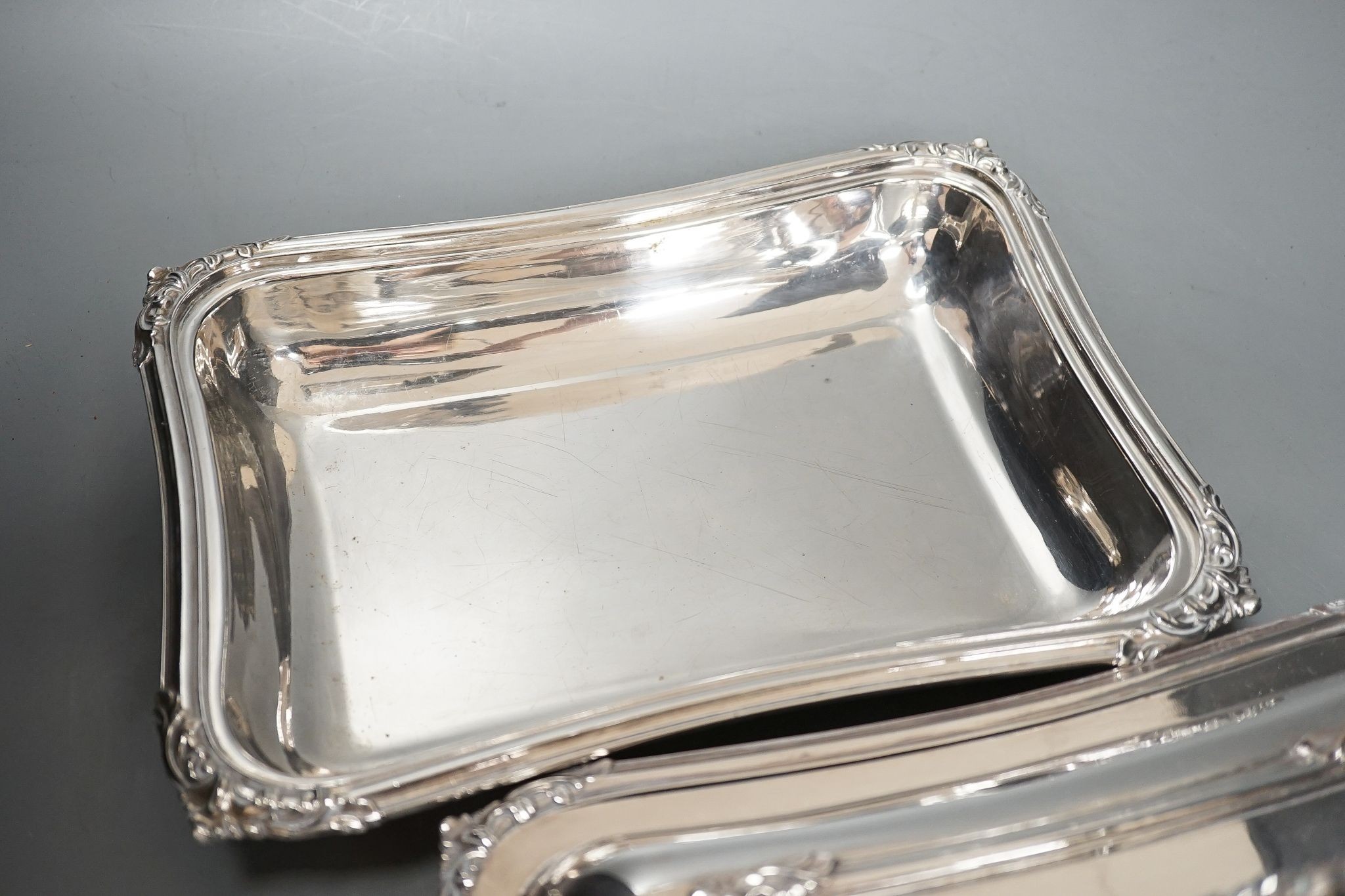 A pair of electroplate entree dishes and covers, 30cm